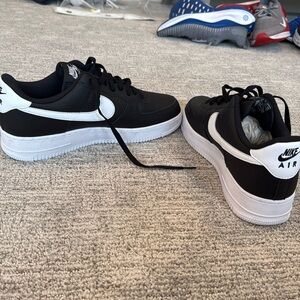 Brand new, black and white, Nike Air Force Ones. Size 12.5.
